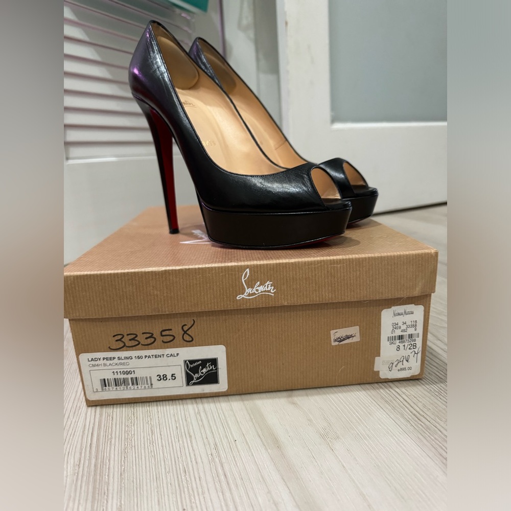 Beautiful iconic red bottoms - lady peep leather heels
